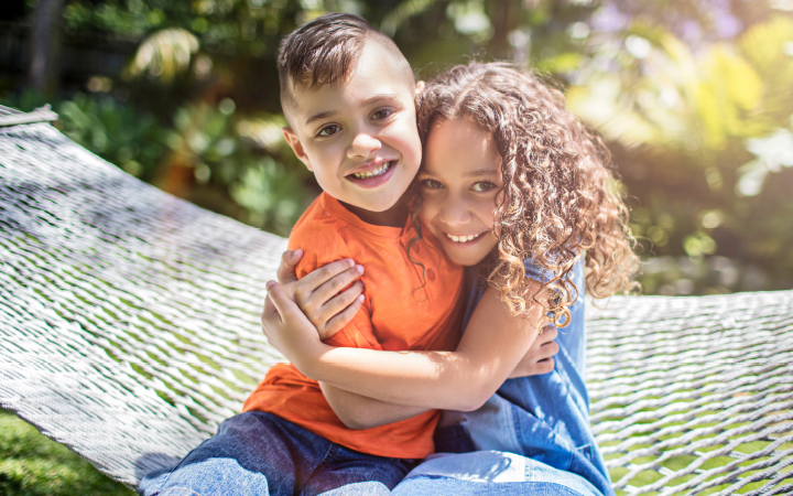 Two children hugging