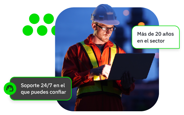 Man in a high vis jacket looking at his laptop