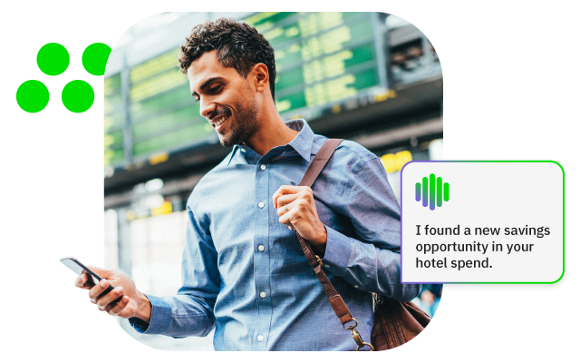 Man in blue shirt at train station checks phone and sees app savings alert.