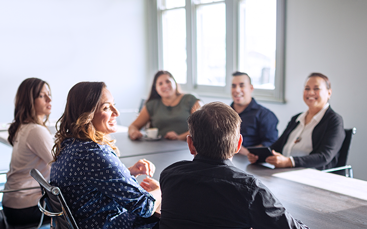 People sitting around a table having a meeting