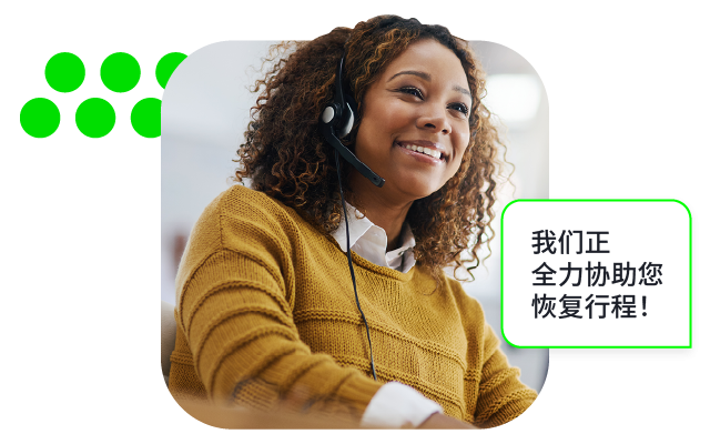 Photo of smiling woman in headset and mustard sweater with green chat bubble graphic