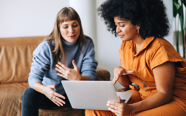 A lady asking a question on her laptop