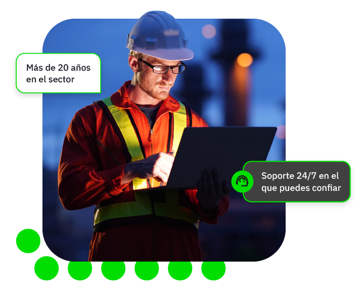 Man in a high vis jackets looking at this laptop
