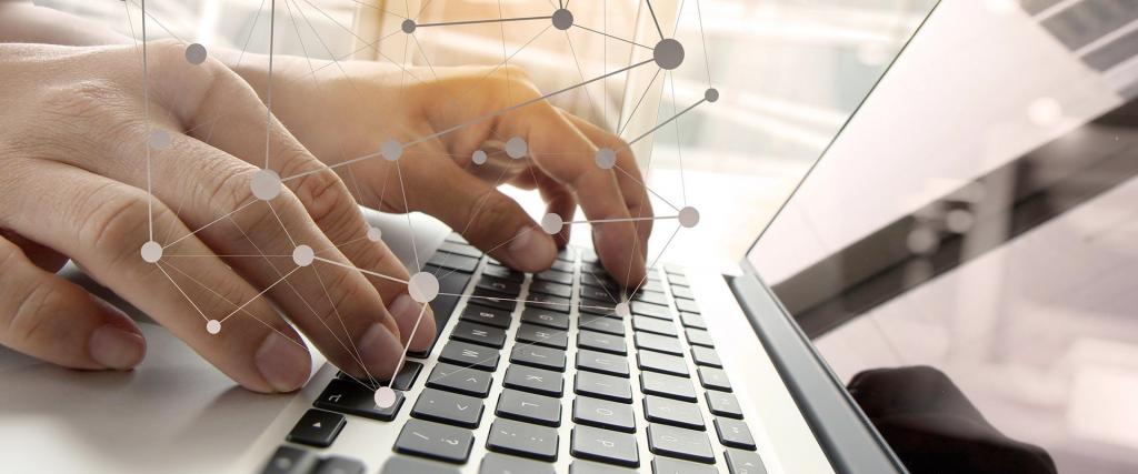 Hands typing on computer keyboard with overlay of connected technology dots