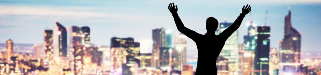 Happy business traveller looking at the city