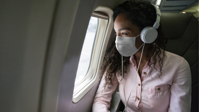 blog asset - case study risk - female on plane - travel - event planning