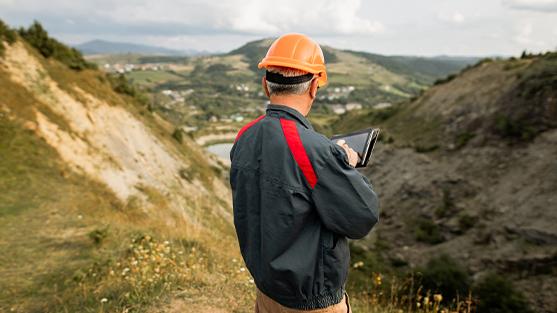 Man on site over looking valley