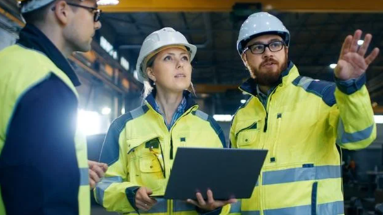3 construction workers discussing on site