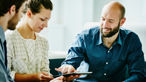 Three business professionals collaborating 