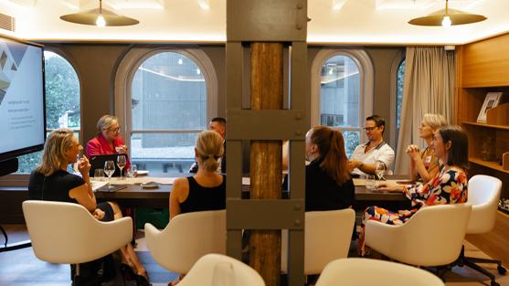 people sitting at table in discussion